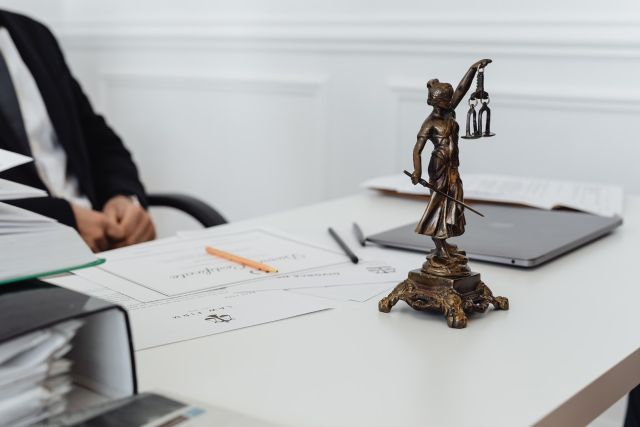 Justice statue on lawyer's office desk working on probate in pike county kentucky
