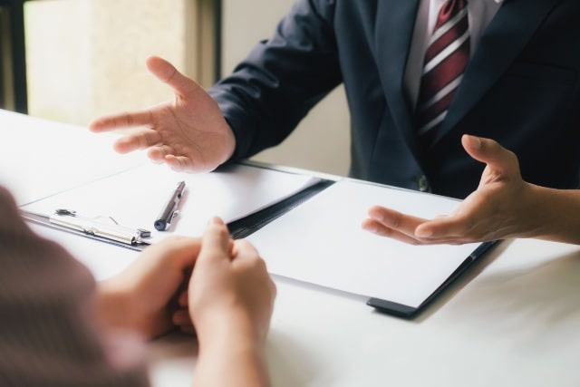 Lawyer meeting discussing miller trusts at a desk in kentucky