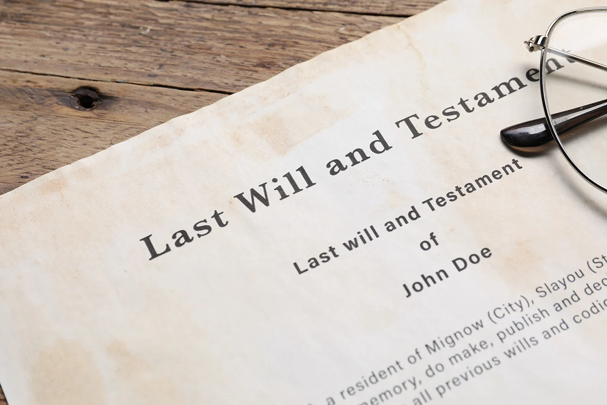 Last will and testament document on table