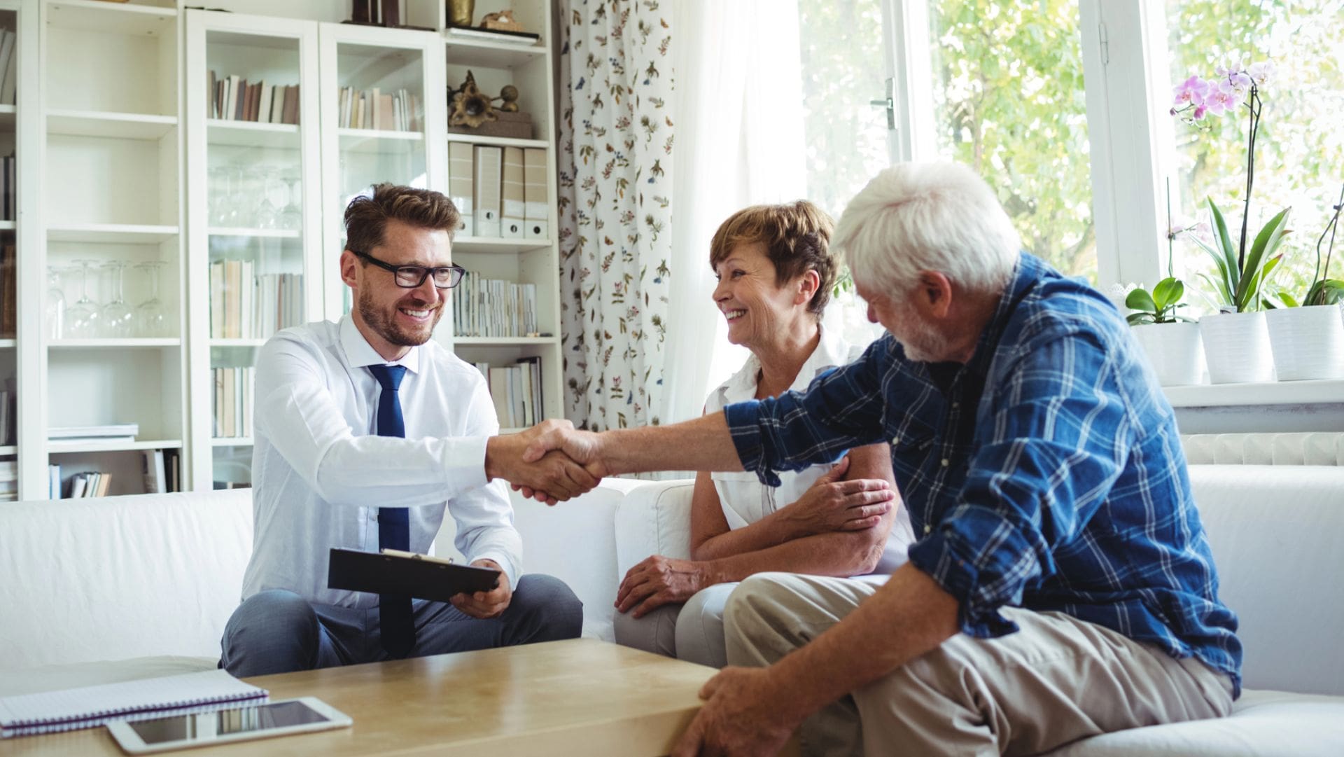 elder lawyer meeting with senior couple at home in richmond kentucky