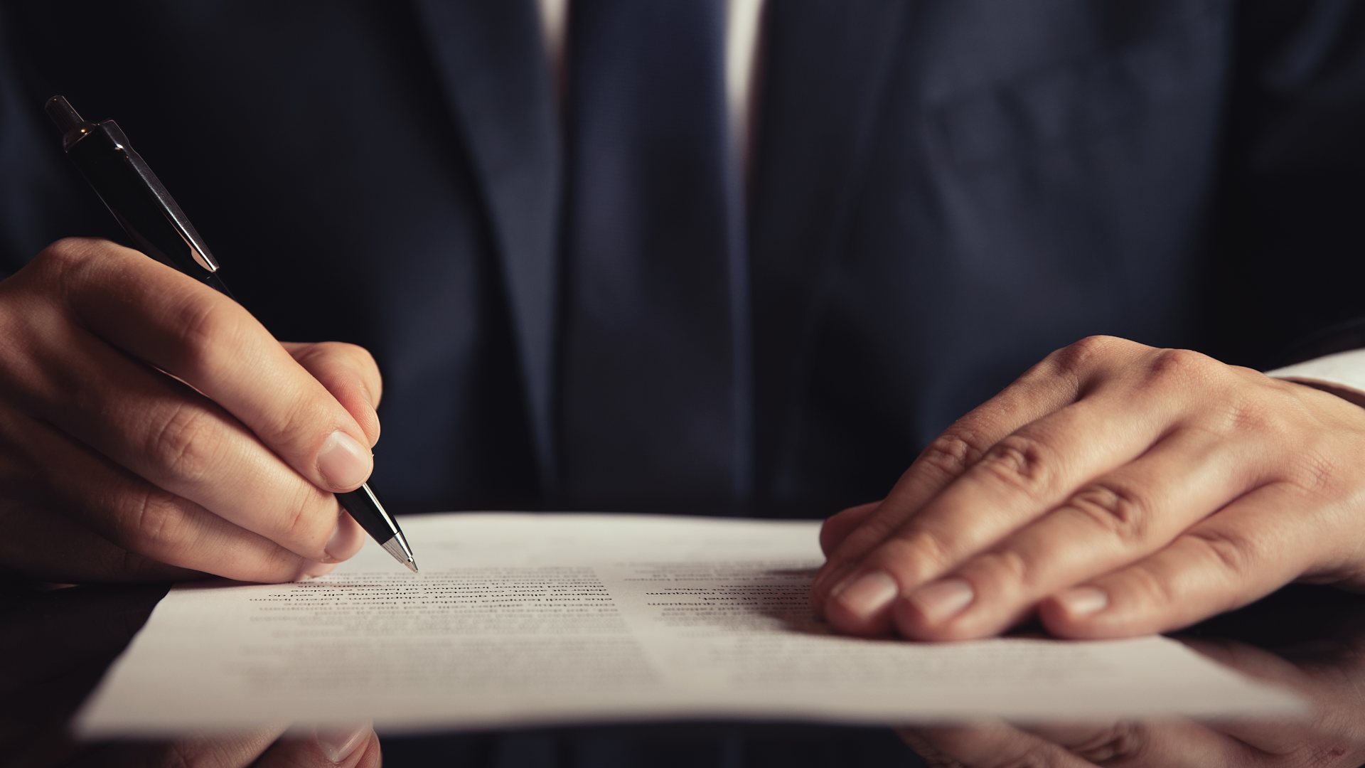 Businessperson signing a elder law legal document